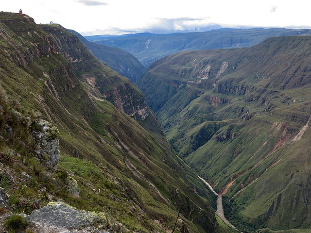 the canyon del sonche , with a riiver in the canyon and forest on the mountains