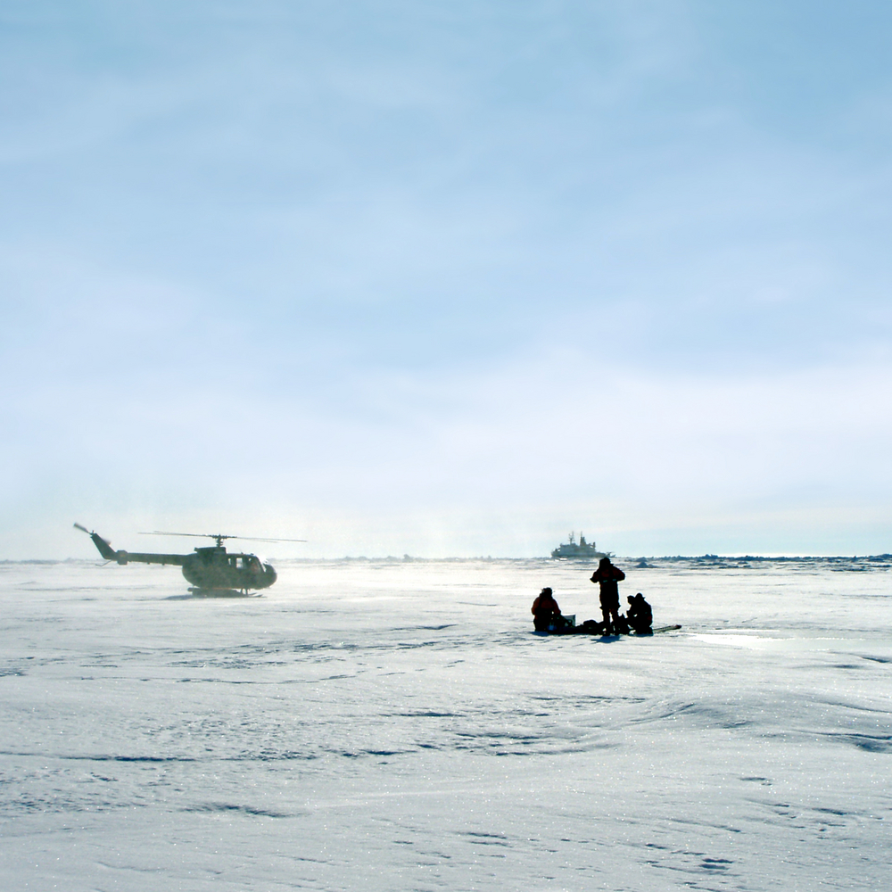 helicopter and people in the snow